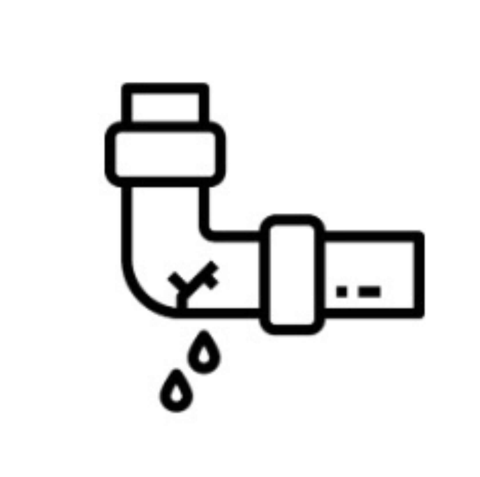 Plomero reparando una tubería con fuga de agua